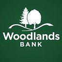 Woodlands Financial Services Company logo